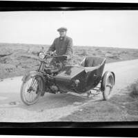 A Taylor on motorcycle with sidecar