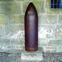15 inch shell outside of the Church House in Widecombe