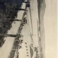 Work on enlarging the Burrator reservoir, showing the suspension bridge which carried traffic to She