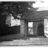 The lych gate and steps at the entrance to Lustleigh Parish Church