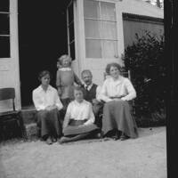 The Ruse family and Mrs Horton on the steps of the "music room", Brimpts Farmhouse