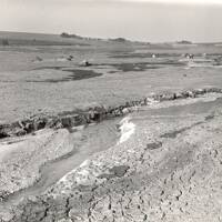 The remaining water channel at Fernworthy Reservoir during the drought of 1959