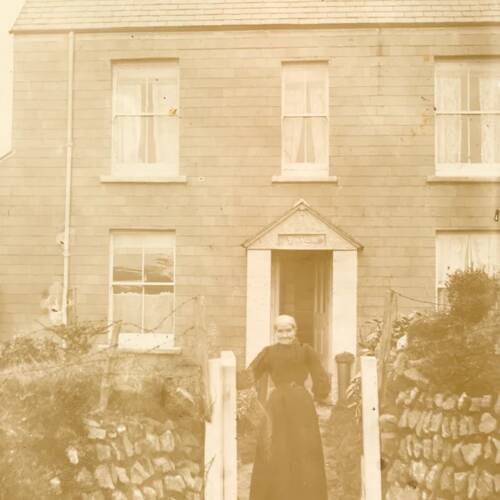 Unknown lady outside Church Cottage, Lydford