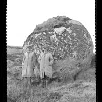 Mr. C. Hallett Watt and Mr. R. Collins standing by large boulder near the Hart Tor brook