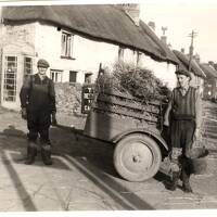 Two Thatchers Transporting Straw