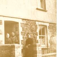 Ladies outside a cottage at Shellaford