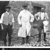 Three dairyman at Town Barton Farm