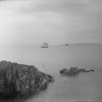 COVE, SAILING SHIP IN DISTANCE