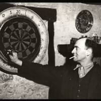 Will Wedlake playing darts in Oxenham Arms