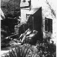 Relaxing outside Foxworthy Mill, 1930s