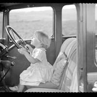 Young Shirley Taylor at the wheel