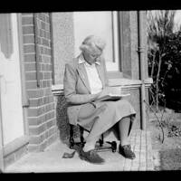 Marjorie Taylor reading on the porch at Gratton 