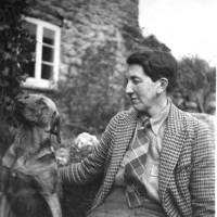 Mrs French ? outside Great Hound Tor Farmhouse with dog