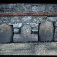 Cross and boundary stones set in wall at Sungates in Plymouth