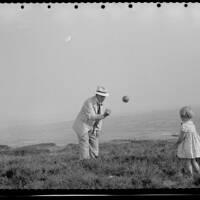 Shirley Taylor and her grandfather (?) playing ball