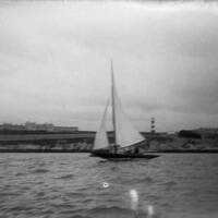 YACHT, PLYMOUTH HOE AND SMEATON LIGHTHOUSE IN BACKGROUND