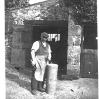 The village blacksmith outside the forge