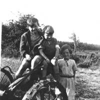 Perryman children on a grass mower at Barracott, c. 1940.