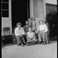 The Horton and Ruse families on the steps of the "music room" at Brimpts Farmhouse