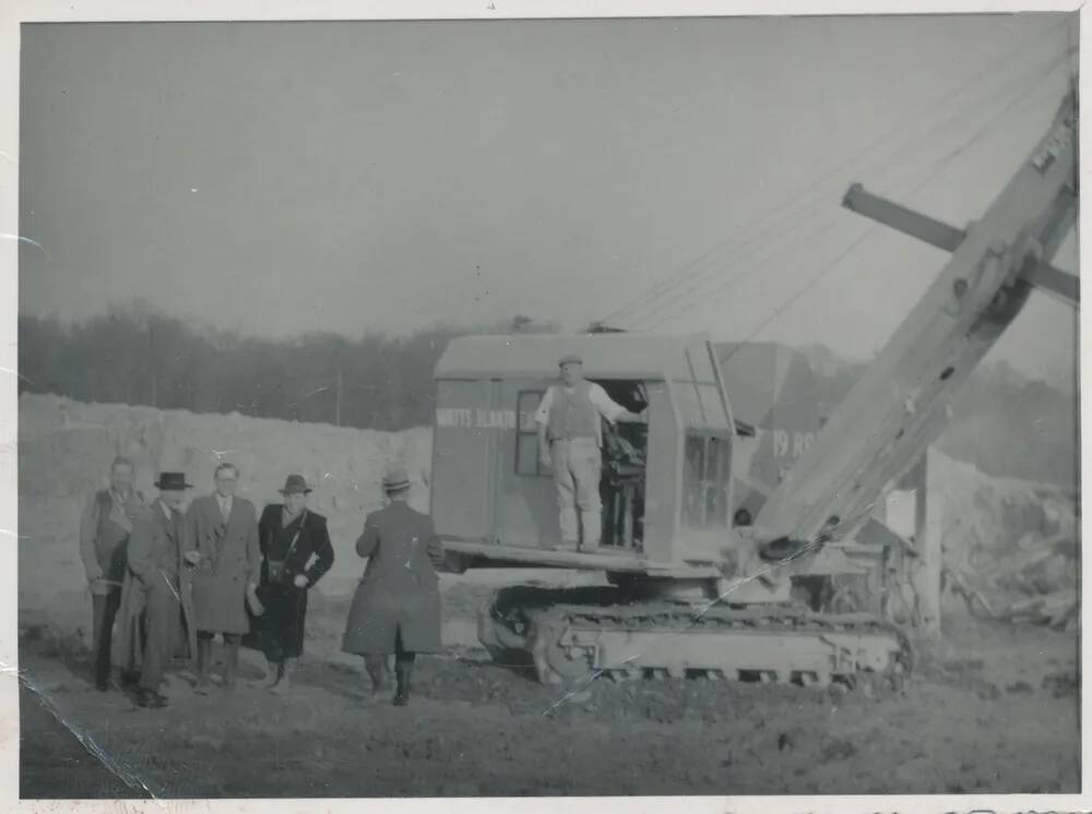 Owners of WBB pose for photo with new digger