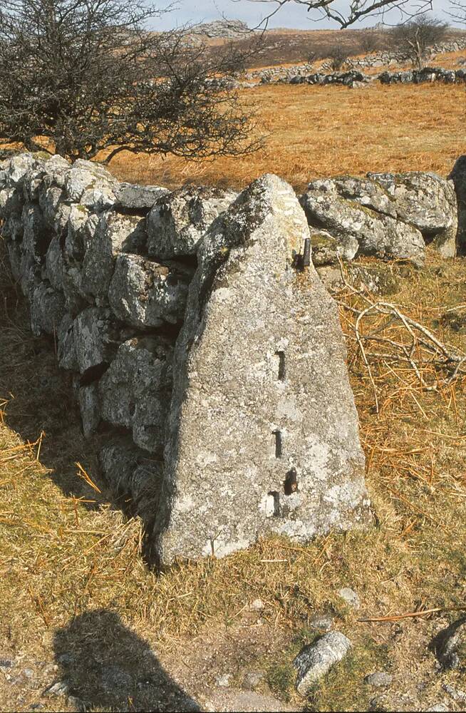 Slotted granite gatepost