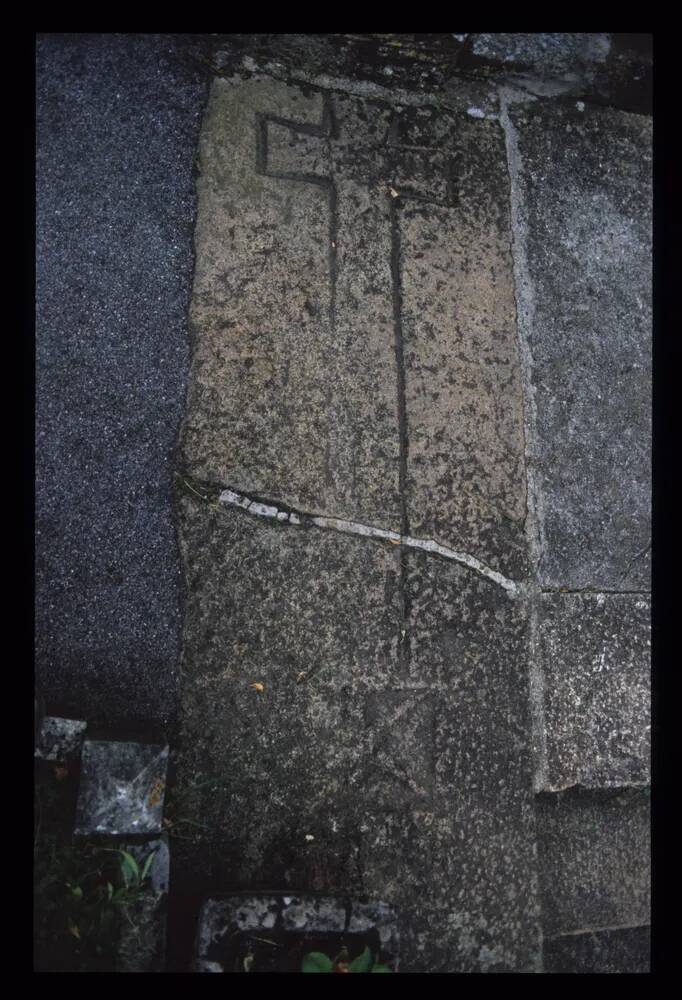 Stone with inscribed cross from porch at Bovey Tracey church