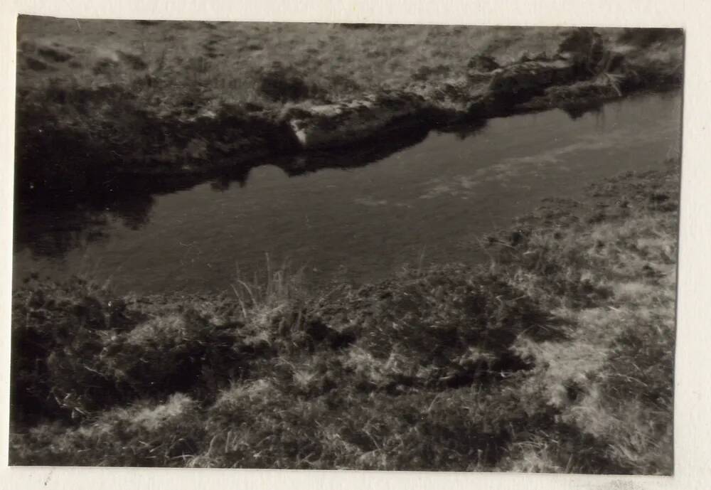 Stones from circle in leat bank.