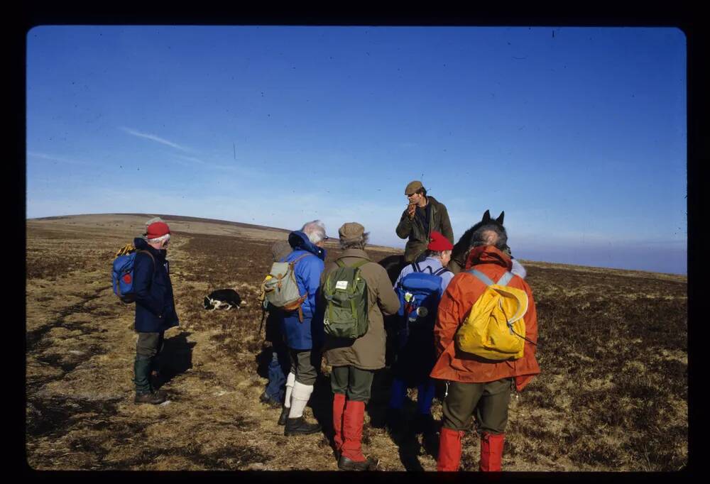 Moorman Jim Reddaway  with walking group on Belstone Tor