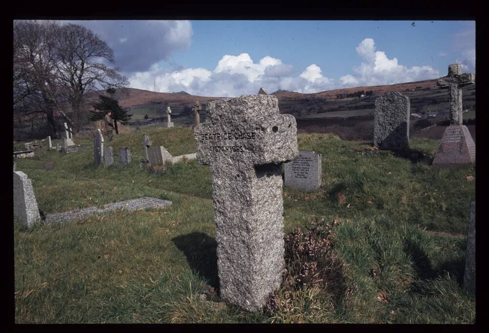 Cross marking grave of Beatrice Chase in Widecombe churchyard.