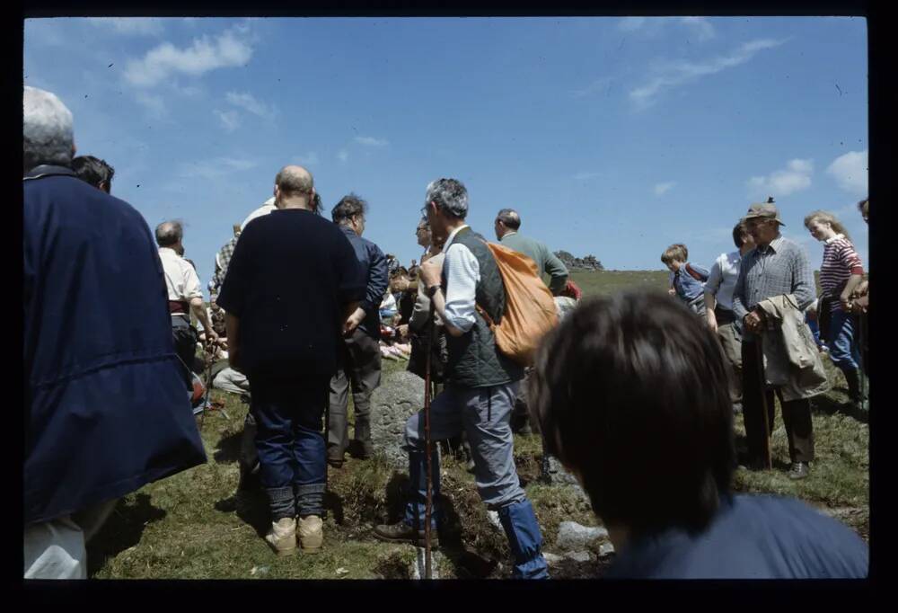 Walkers near boundary stones at Belstone tor