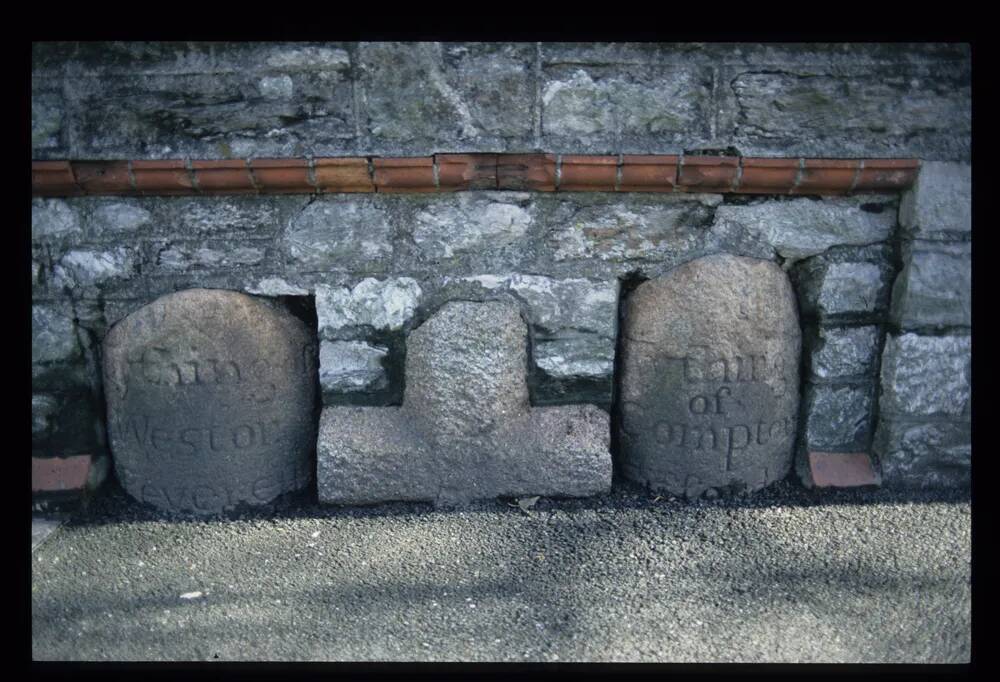 Cross and boundary stones set in wall at Sungates in Plymouth