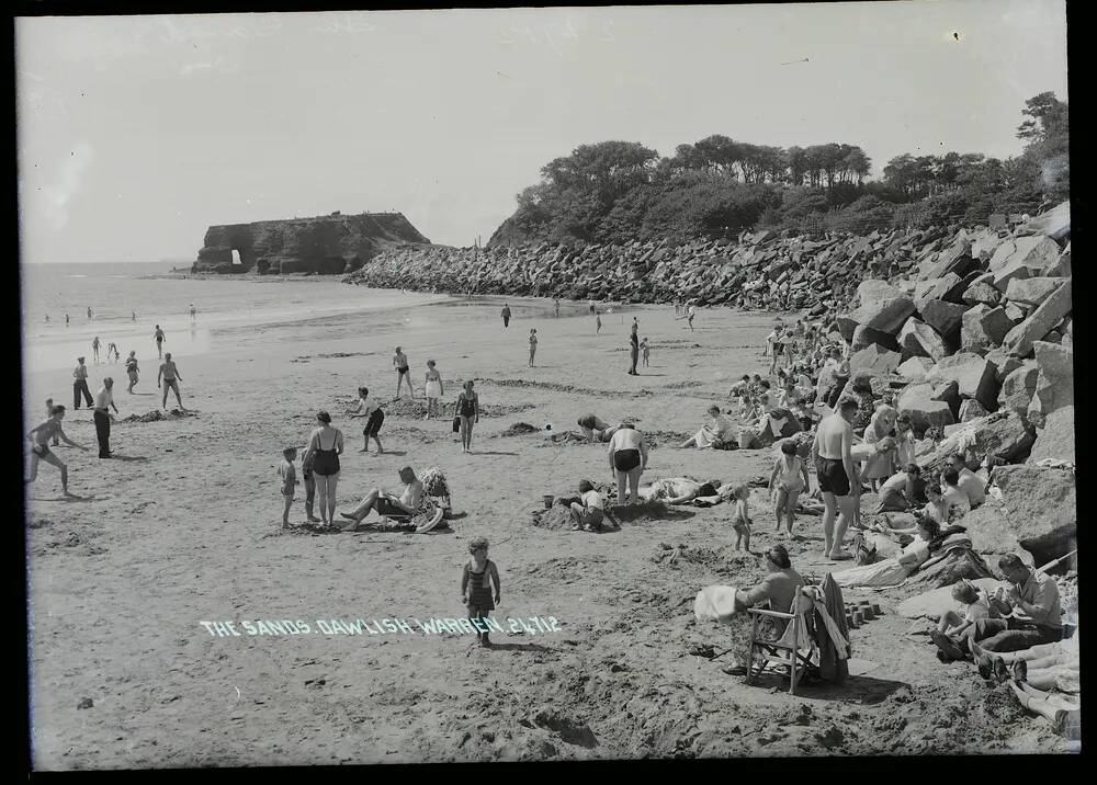 Families sunbathe and enjoy the sunshine on 'The Sands', Dawlish Warren