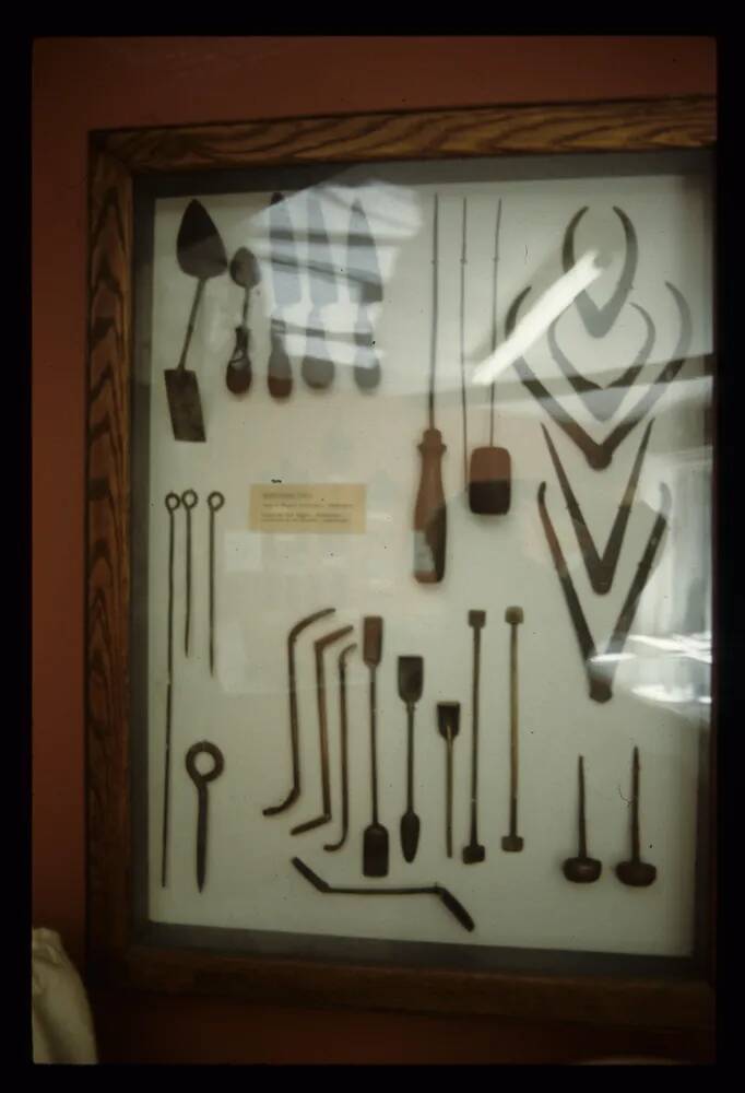 Tools used at Glass's Iron Foundry displayed in a glass cabinet